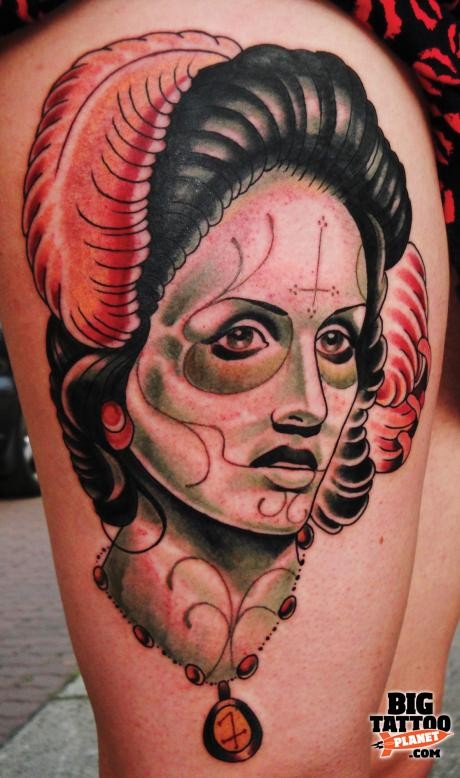 Mexican traditional style colored thigh tattoo of woman portrait with feather