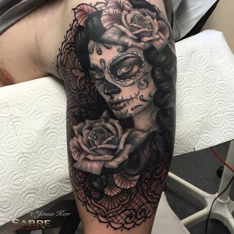 Mexican traditional style upper arm tattoo of woman portrait with big rose by Jenna Kerr