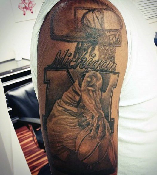 Michael Jordan themed tattoo on shoulder with lettering