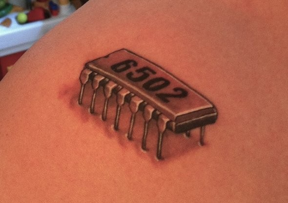 Microchip geek tattoo on back
