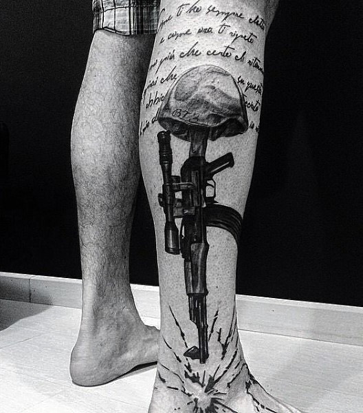 Military themed dramatic black ink tattoo with lettering and rifle on leg