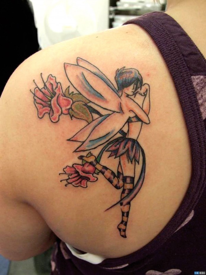 Mischievous fairy tattoo on shoulder blade