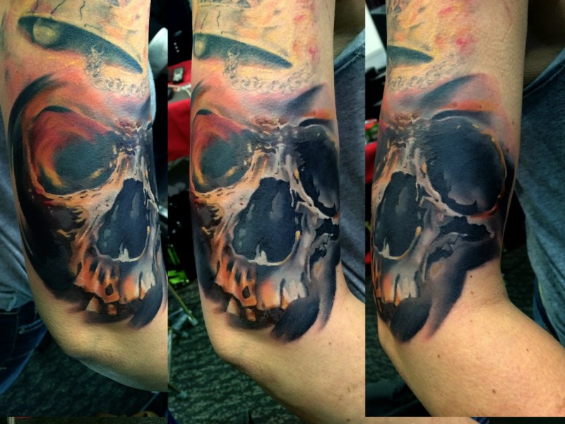 Modern style colored arm tattoo of human skull part
