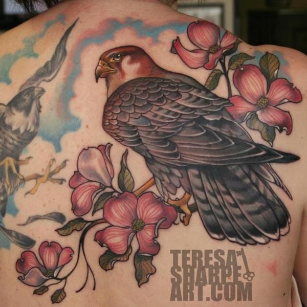 Modern style colored beautiful eagle tattoo combined with blooming tree