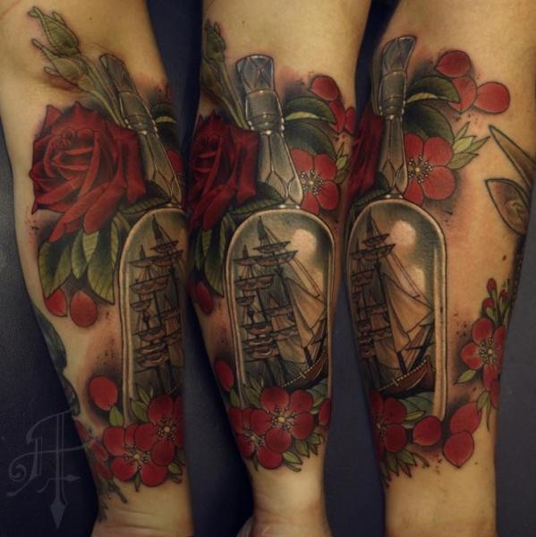 Modern style colored forearm tattoo of bottle with ship and flowers