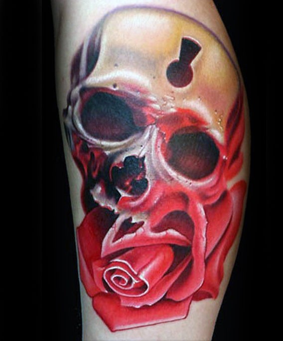 Modern style colored leg tattoo of big rose with human skull stylized with keyhole