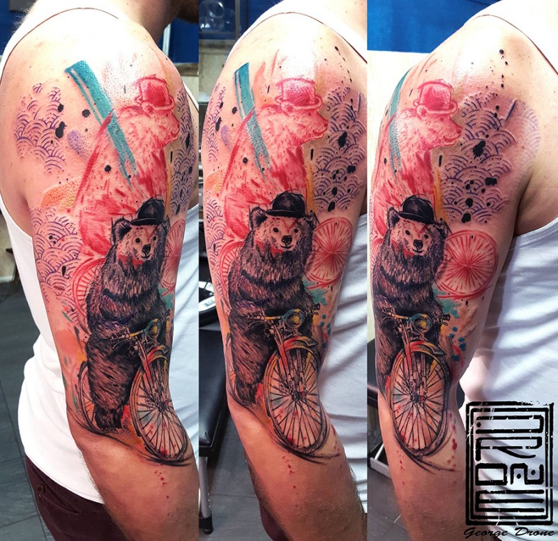 Modern style colored shoulder tattoo of funny bear riding bicycle