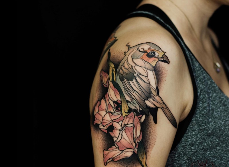 Modern style colored shoulder tattoo of big eagle with flower