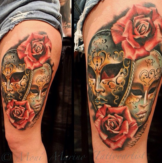 Modern style colored thigh tattoo of various masks and flowers
