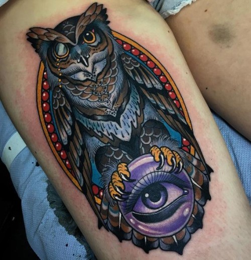 Modern style colored thigh tattoo of amazing owl with magical orb