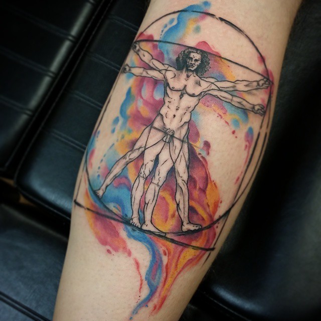 Modern style colored Vitruvian Man tattoo on leg
