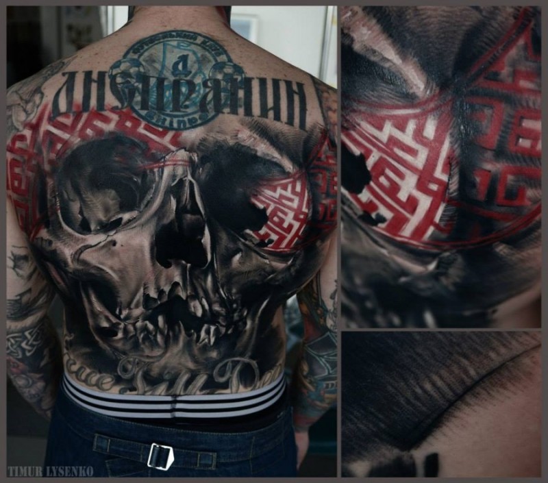 Modern style colored whole back tattoo of human skull with lettering