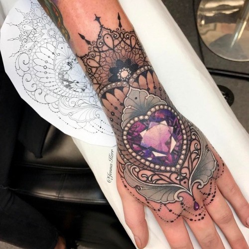 Modern style colored wrist tattoo of heart shaped diamond by Jenna Kerr