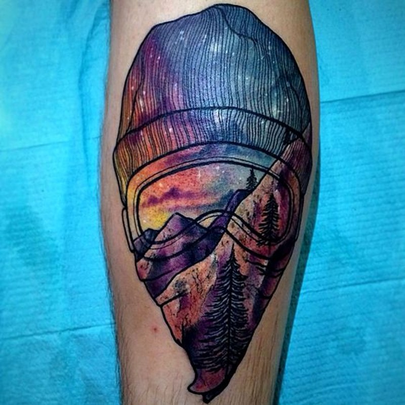 Modern style painted masked man stylized with mountains tattoo on arm
