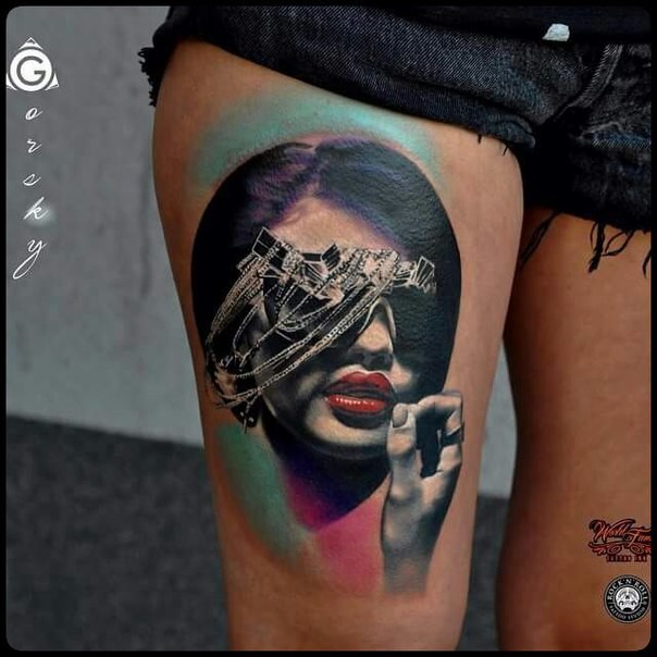 Modern surrealism style colored thigh tattoo of woman with jewelries