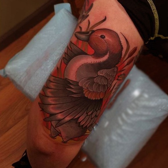 Modern traditional colored arm tattoo of duck