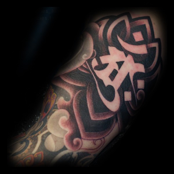 Modern traditional style colored arm tattoo of fantasy symbol