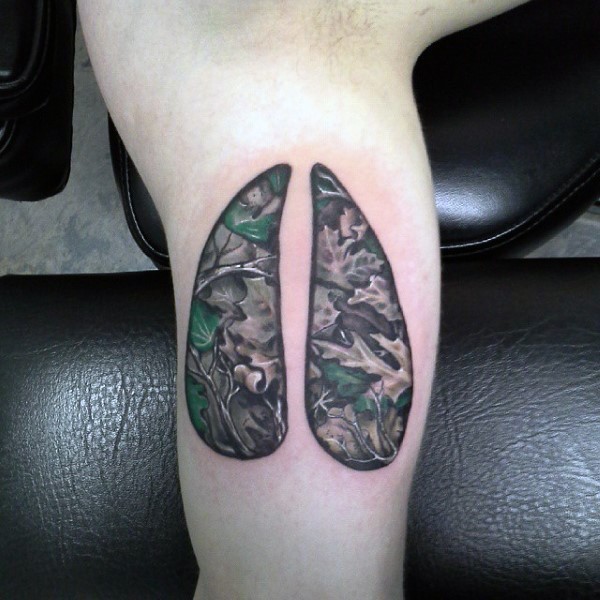 Modern traditional style colored human lungs tattoo with corrupted leaves