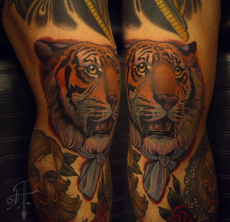 Modern traditional style colored leg tattoo of tiger head