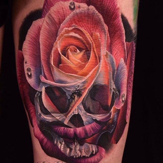 Modern traditional style colored shoulder tattoo of skull with rose