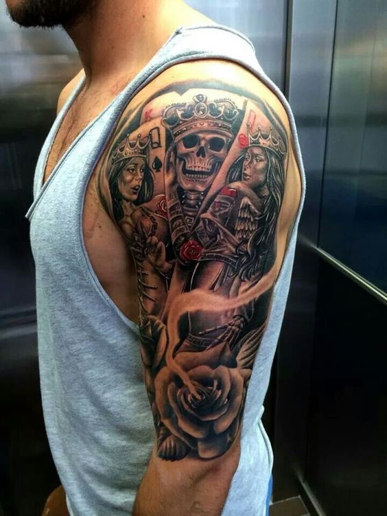 Modern traditional style colored shoulder tattoo of cool looking playing cards with roses