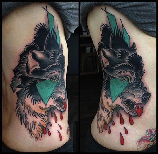 Modern traditional style colored side tattoo of bloody wolf