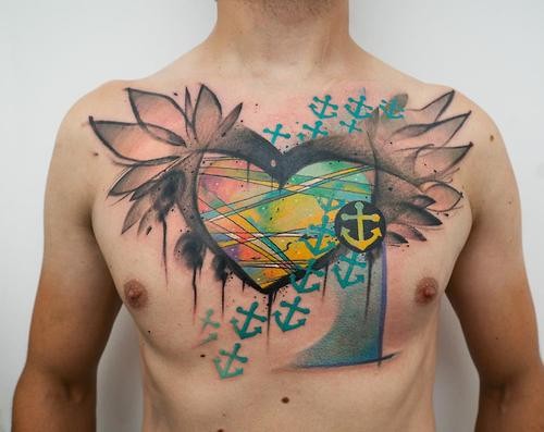Multicolored chest tattoo of human heart with anchor