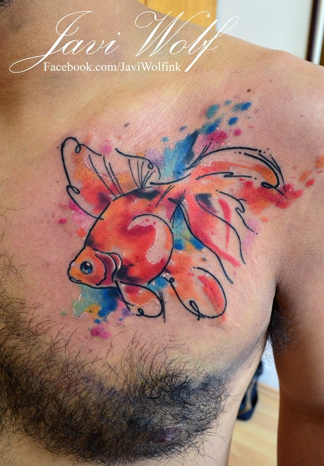 Multicolored swimming golden fish tattoo on chest by Javi Wolf in watercolor style