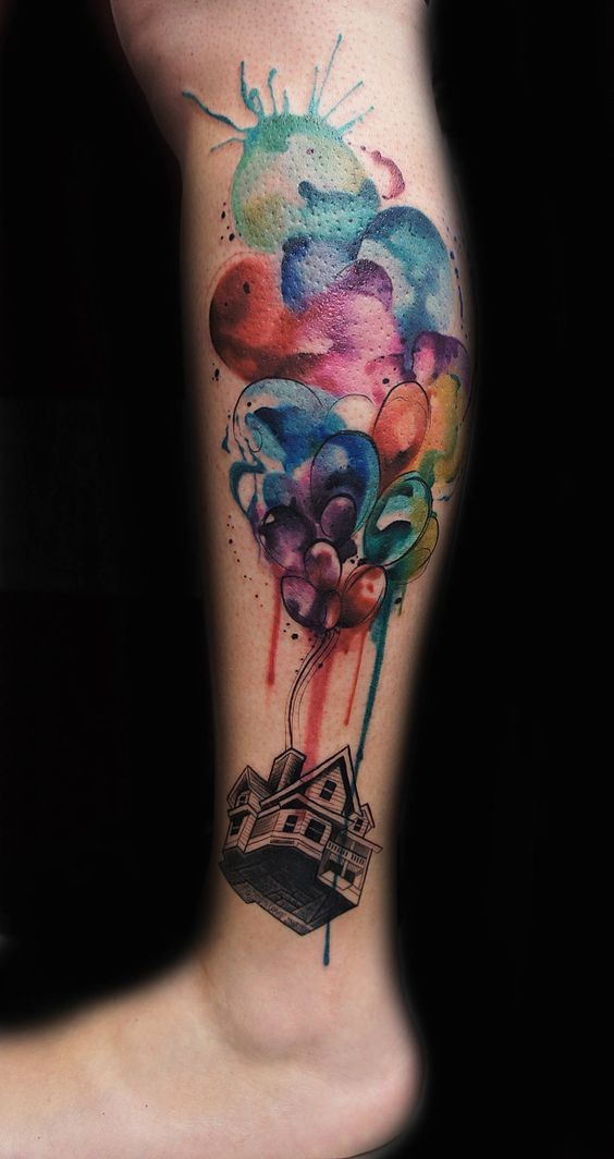 Multicolored watercolor house flying on air balloons tattoo with paint drips