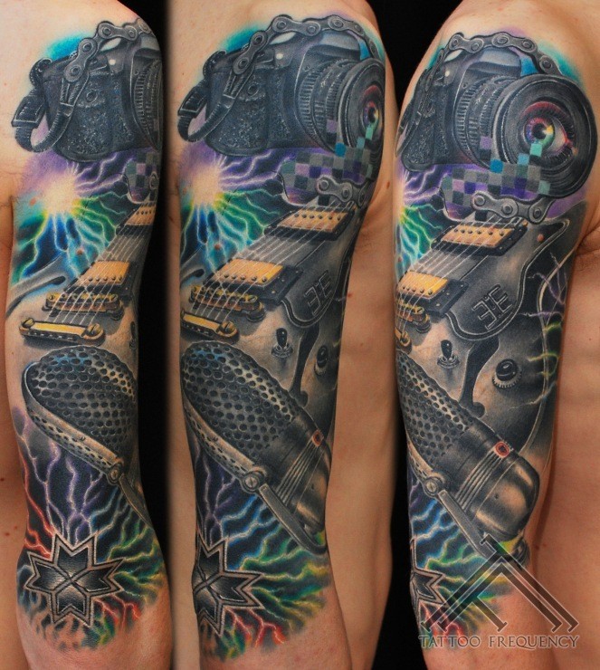 Music themed great painted and colored massive sleeve tattoo