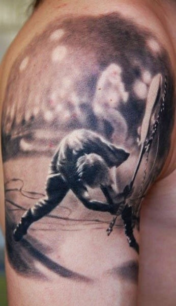 Tatuaje de músico con guitarra  en el brazo