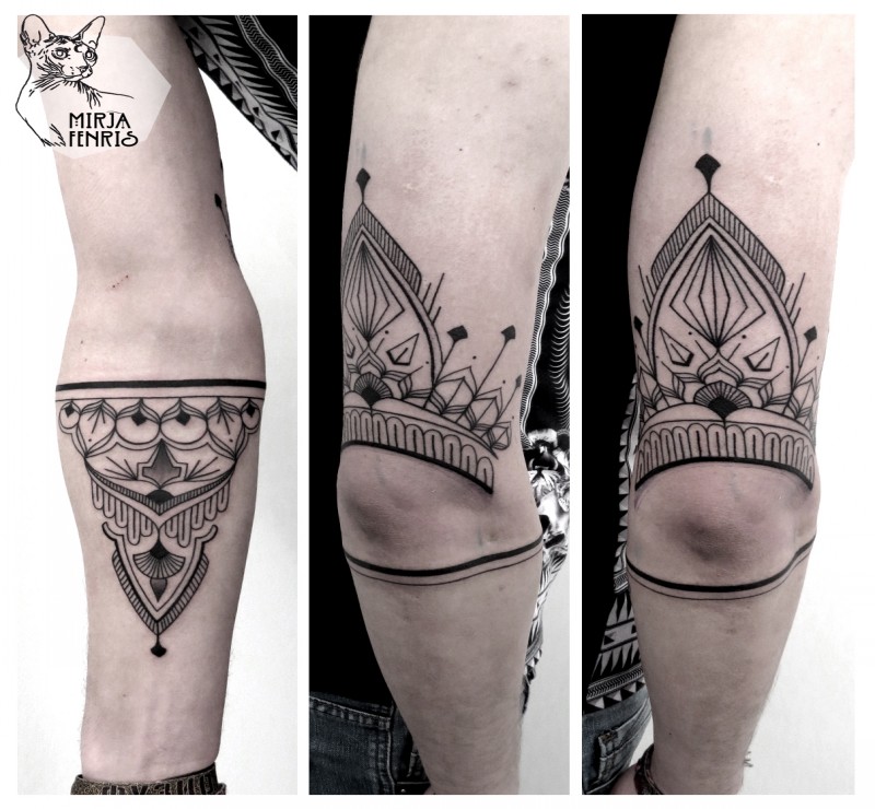 Mysterious black ink arm tattoo of mystical ornament
