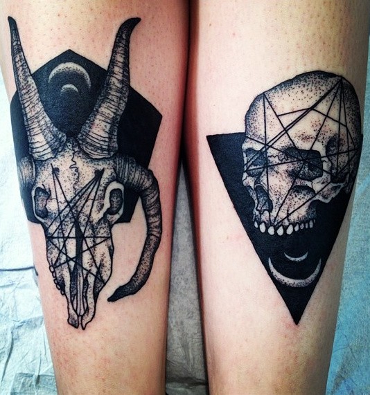 Mysterious black ink arms tattoo of demonic goat skull with human skull