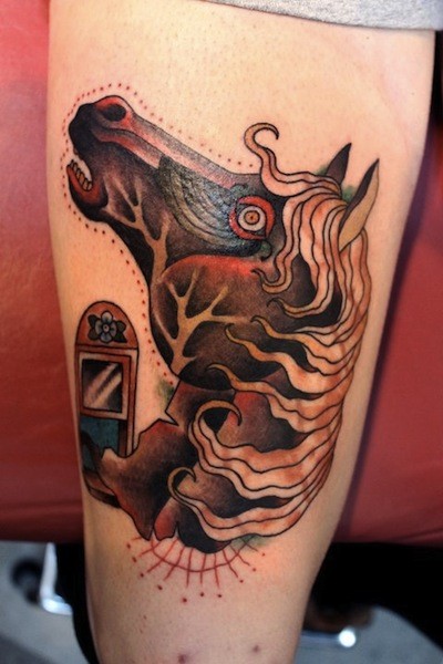 Mysterious looking colored arm tattoo of horse head with mirror
