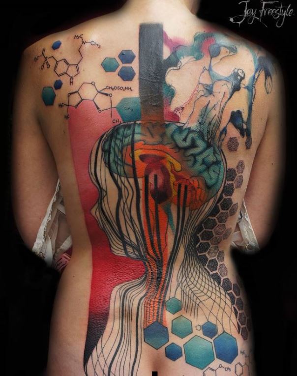 Mysterious looking colored whole back tattoo of human figure with various ornaments