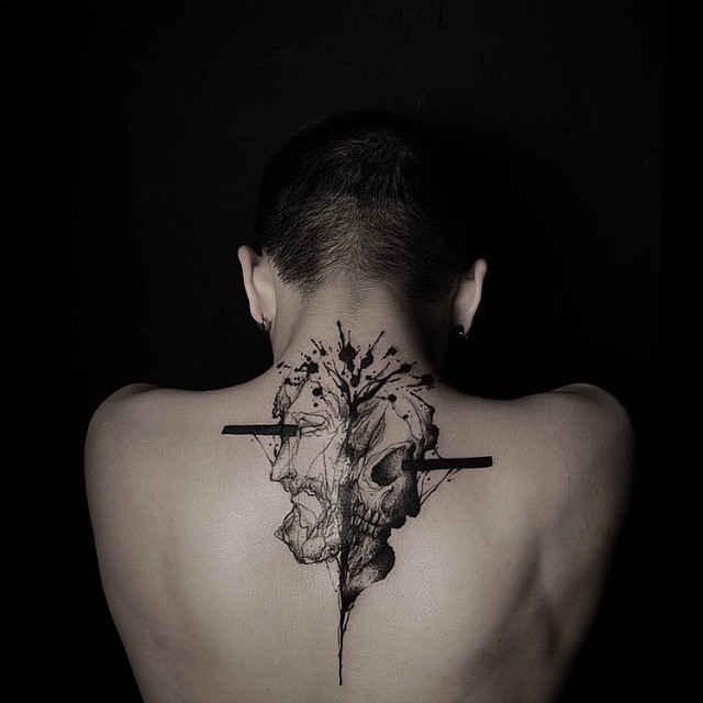 Mystical black ink engraving style half man half skull tattoo on back