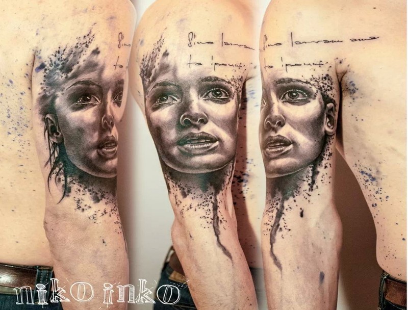 Mystical black ink shoulder tattoo of scary woman face