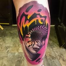 Mystical colored leg tattoo of woman face with lettering and hypnotic ornament