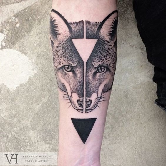 Mystical half geometrical style painted by Valentin Hirsch tattoo of symmetrical fox head and triangles