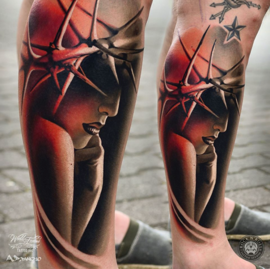 Mystical looking colored leg tattoo of woman portrait with vine