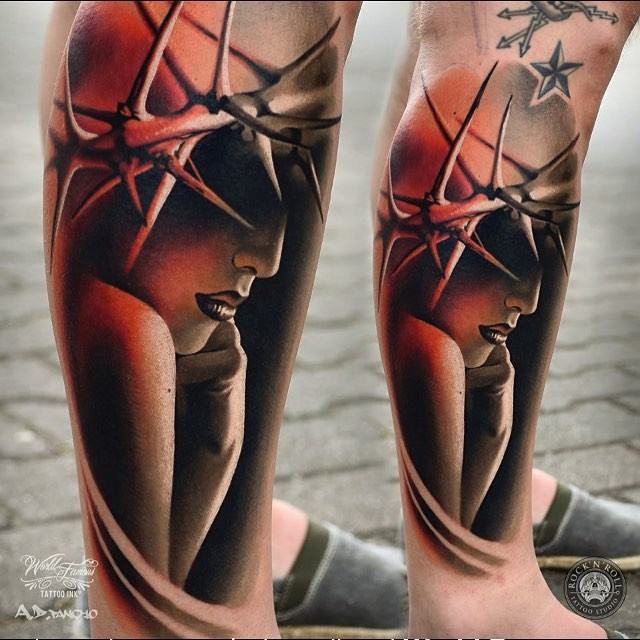 Mystical looking colored leg tattoo of woman with vine