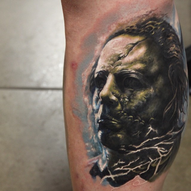 Mystical zombie like colored monster tattoo on leg