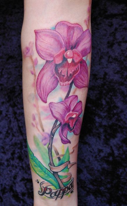 Name and pink orchids forearm tattoo
