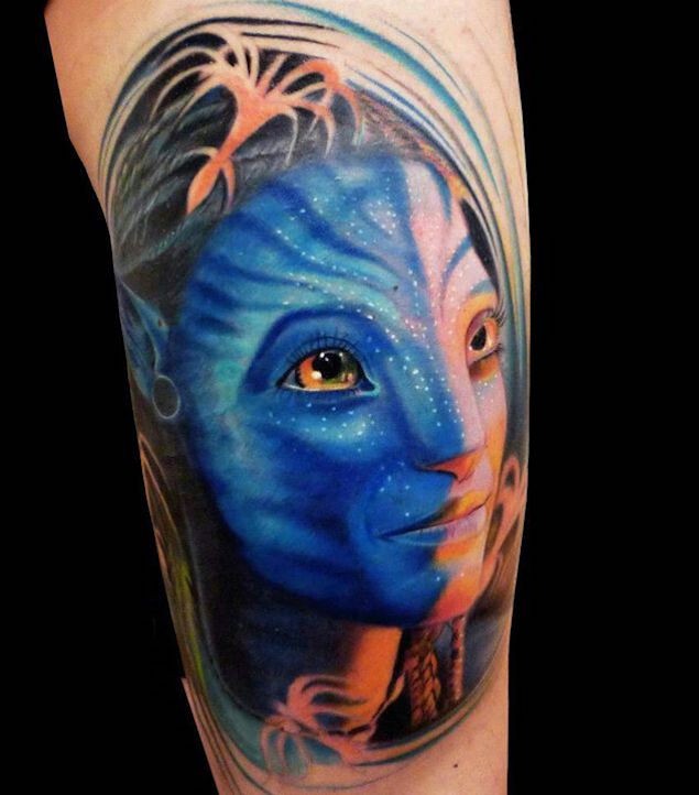 Natural looking 3D style painted upper arm tattoo of Avatar woman hero portrait