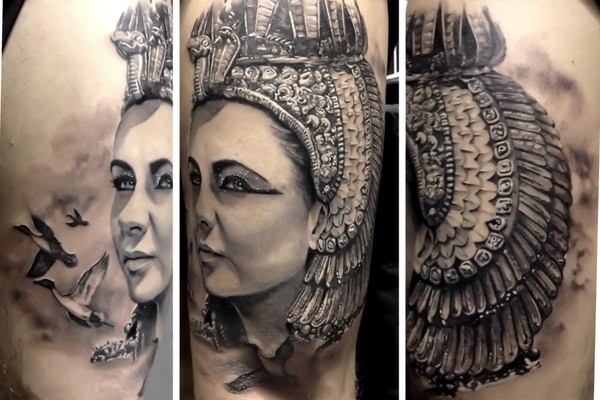 Natürlich aussehendes großes schönes Tattoo mit ägyptischer Frau und verschiedenen Vögeln