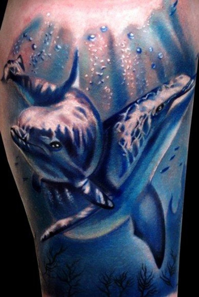 Natural looking big colored dolphins tattoo on leg