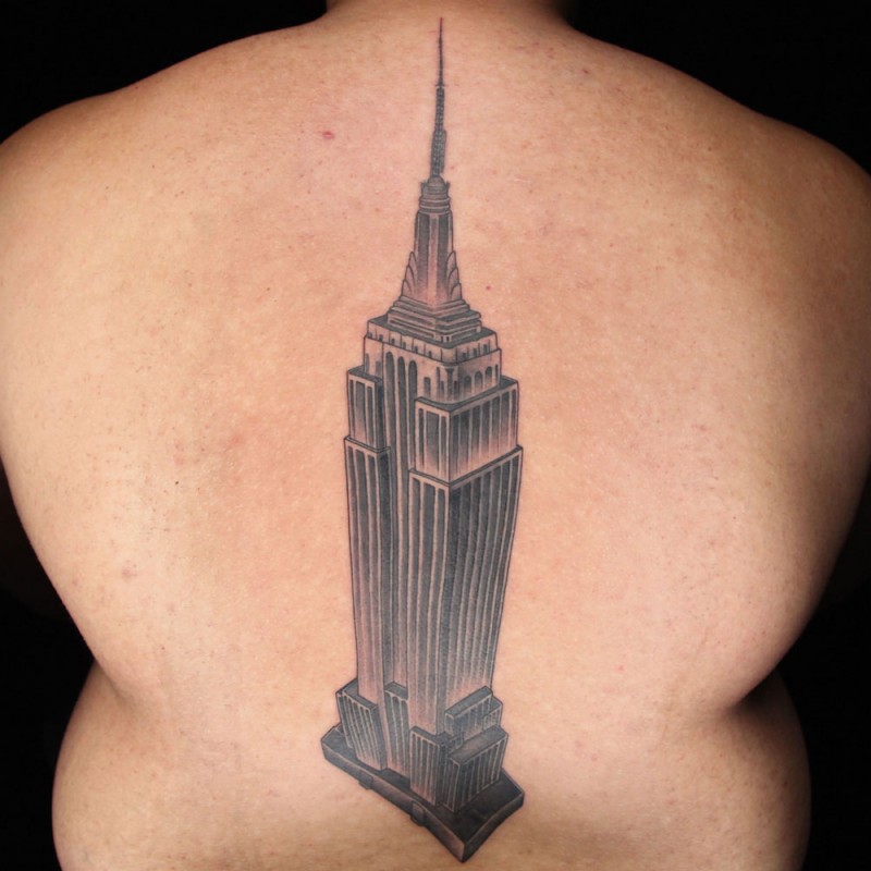 Natural looking black and white back tattoo of Empire State Building