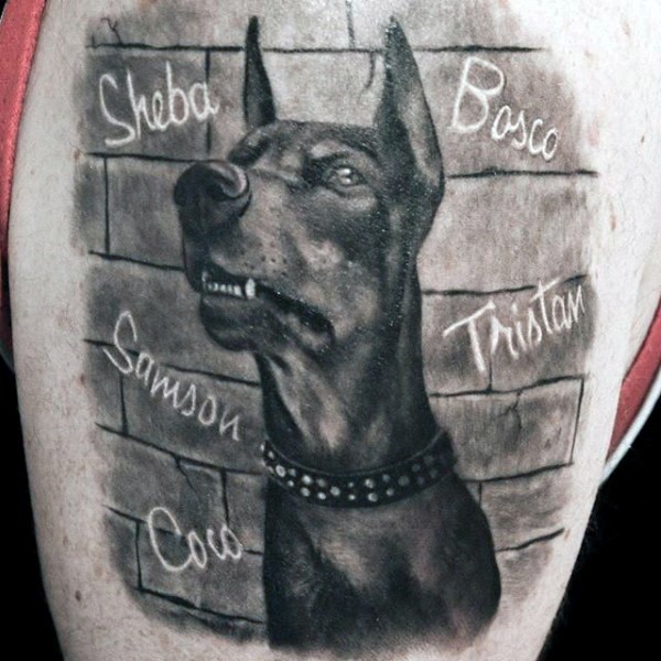 Natural looking black and white detailed dog shoulder tattoo with lettering