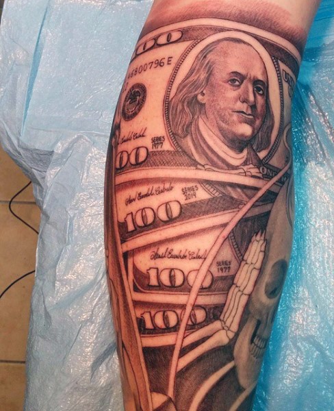 Natural looking black and white detailed dollar bills tattoo on leg