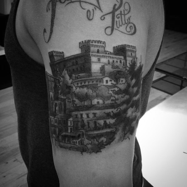 Natural looking black and white old medieval castle shoulder tattoo with lettering